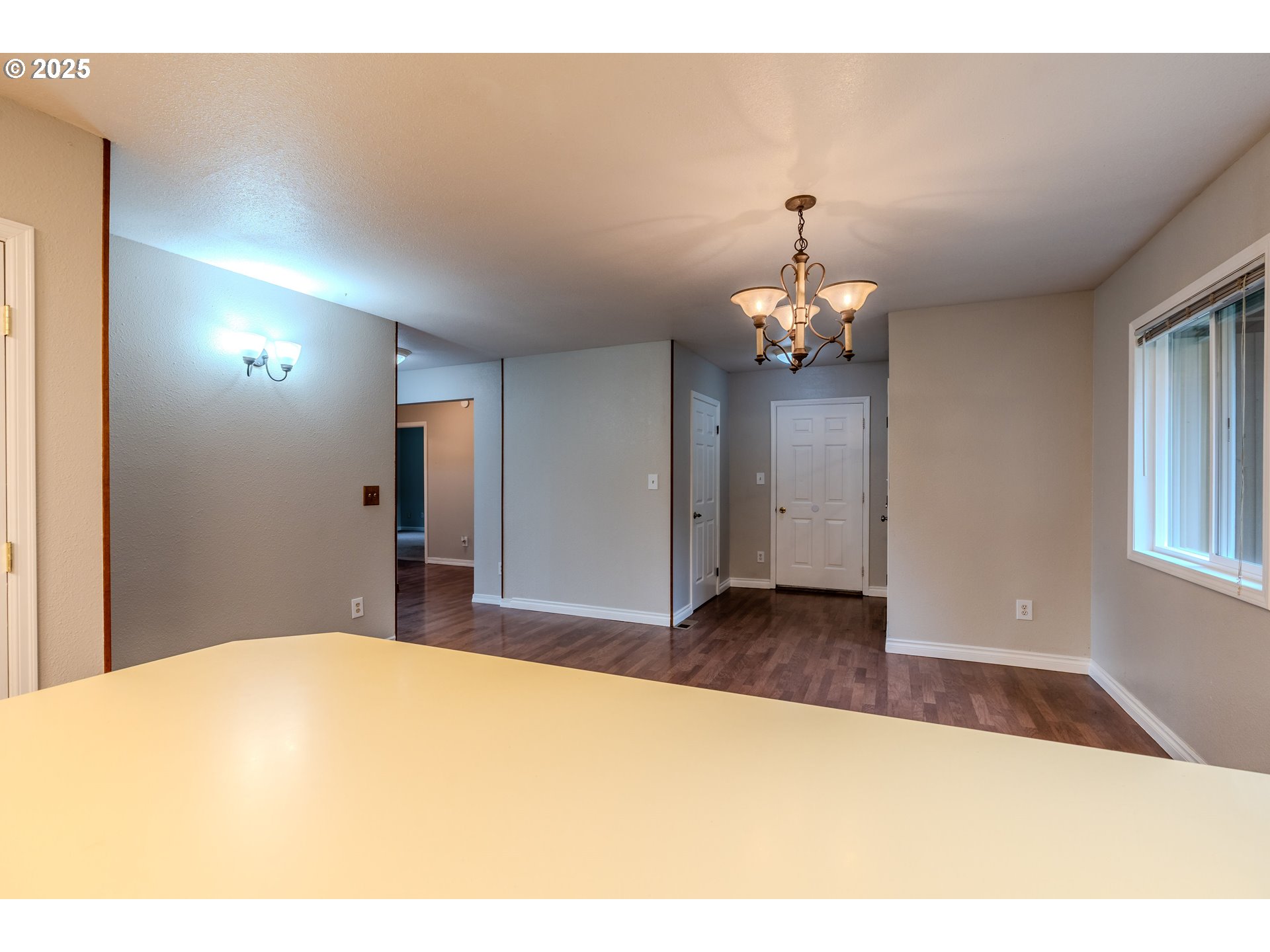 35709 Southeast Lusted Road Boring, OR 97009 - Photo 12 of 48 a bedroom with a bed and a chandelier