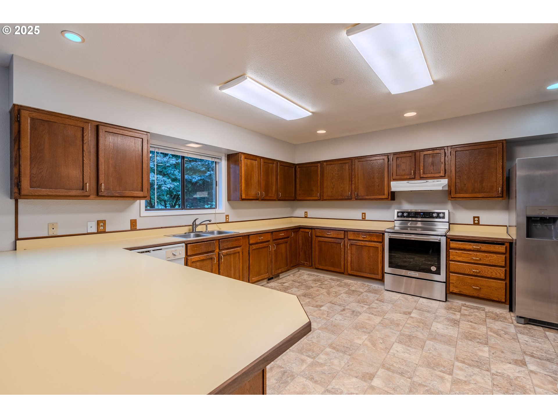 35709 Southeast Lusted Road Boring, OR 97009 - Photo 14 of 48 a kitchen with stainless steel appliances a stove sink and cabinets