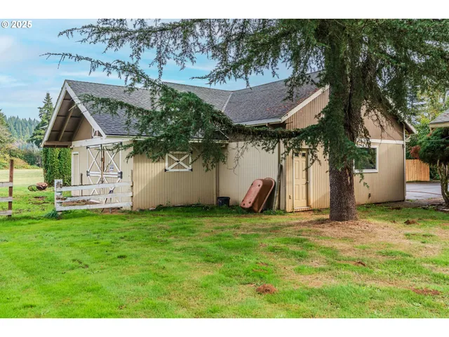 a view of a house with a yard and plants