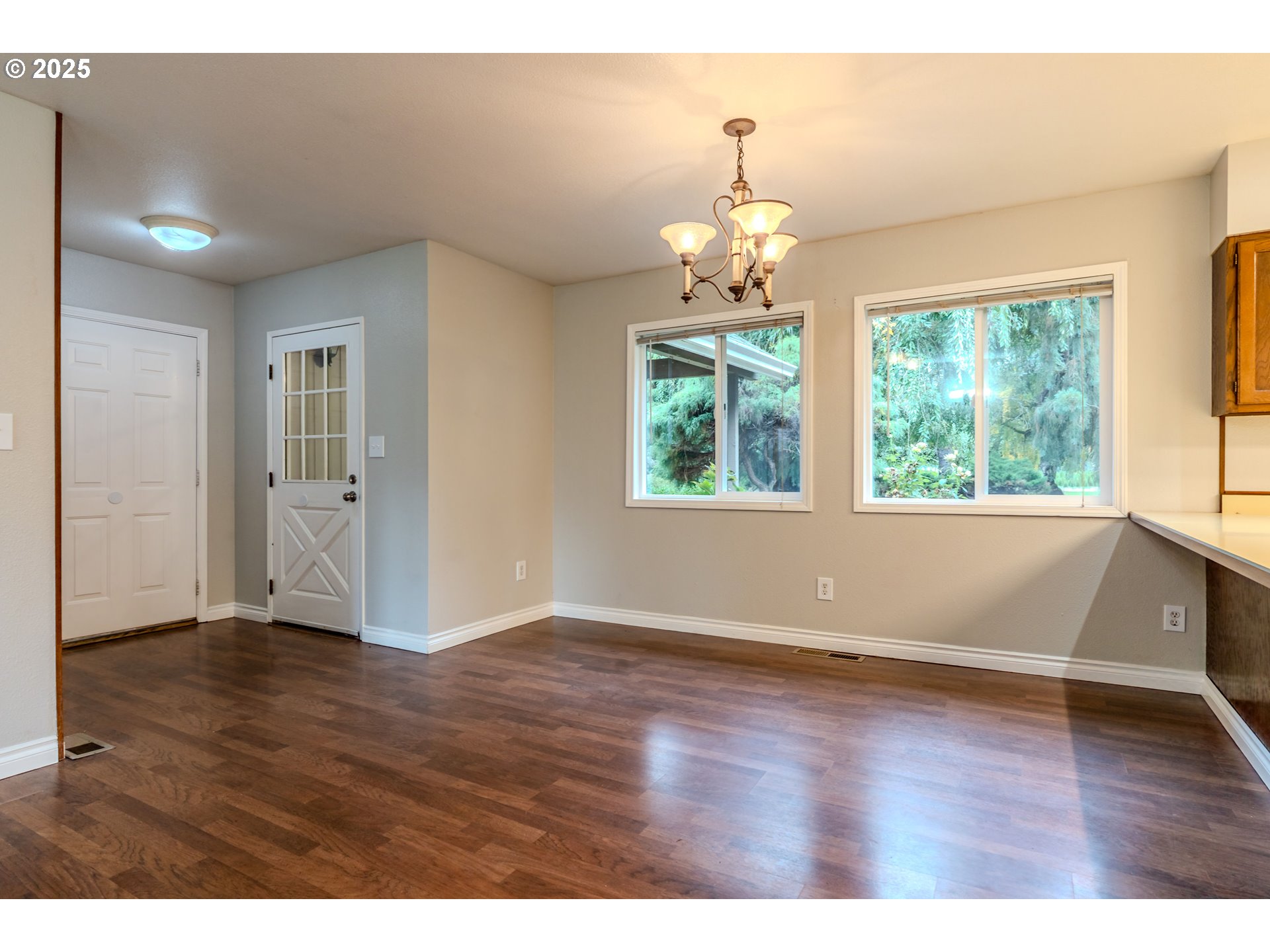 35709 Southeast Lusted Road Boring, OR 97009 - Photo 9 of 48 an empty room with wooden floor and windows