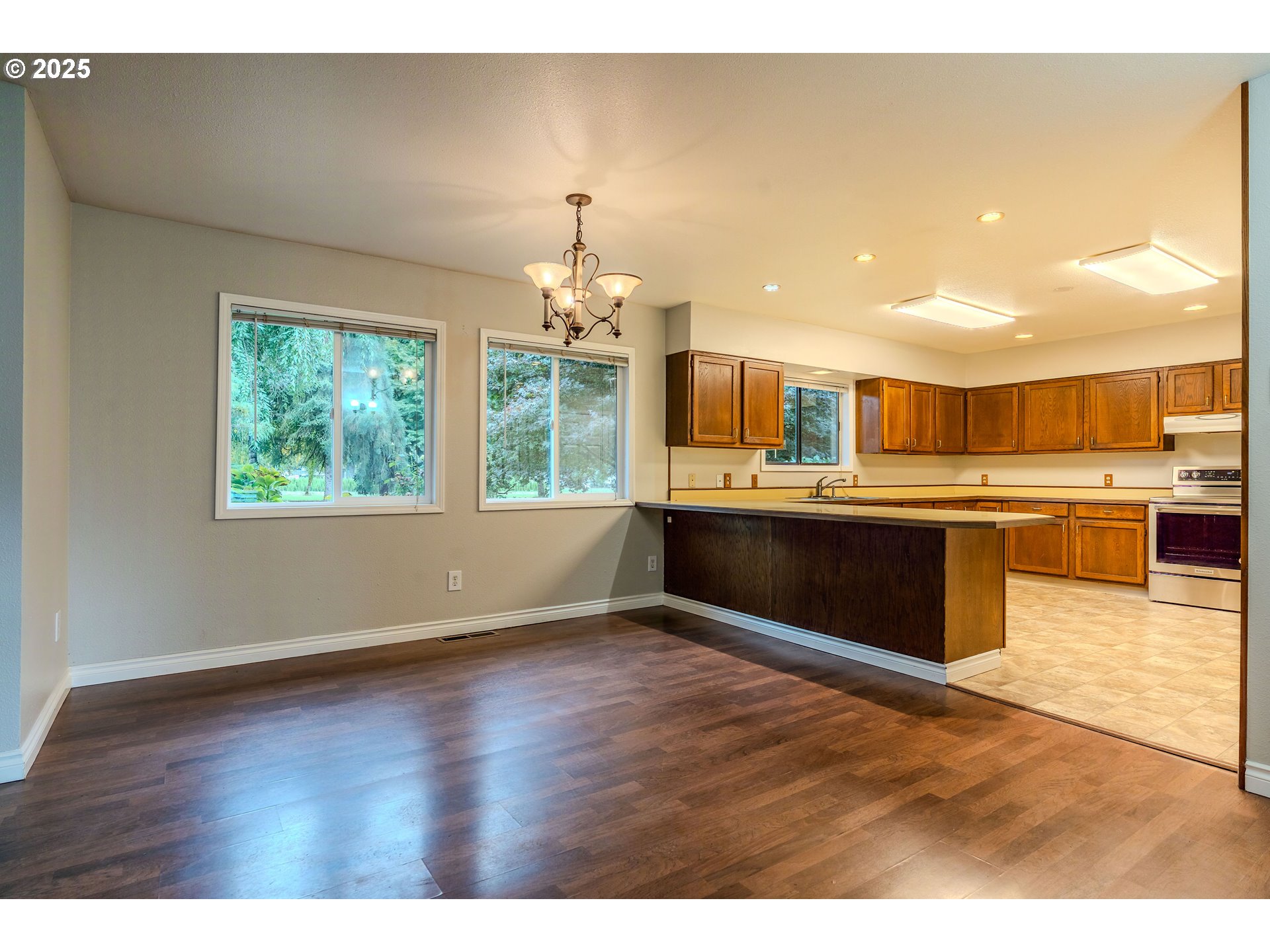 35709 Southeast Lusted Road Boring, OR 97009 - Photo 10 of 48 a view of kitchen with granite countertop window and wooden floor