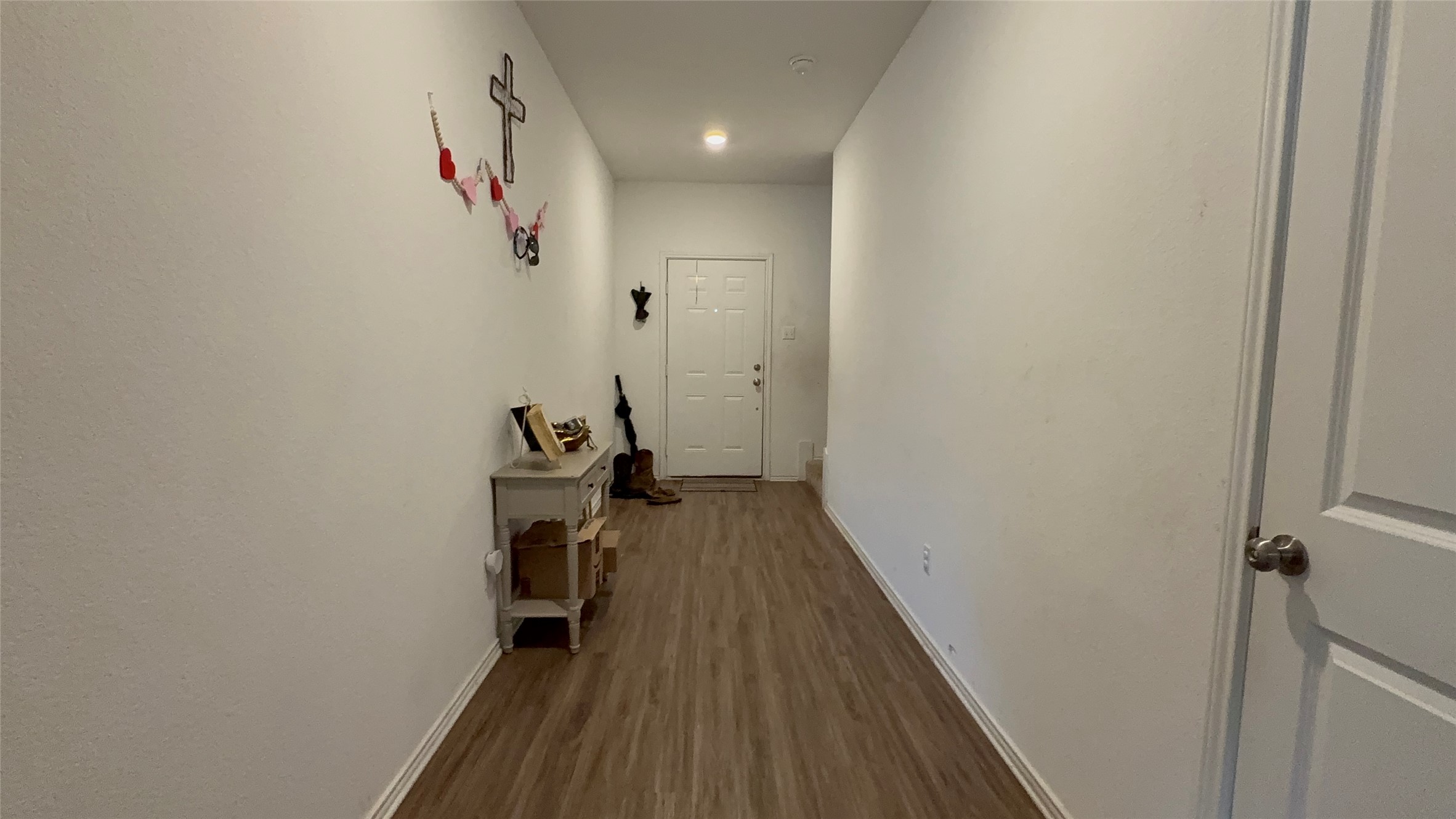 316 Geode Glen Maxwell, TX 78656 - Photo 11 of 24 a view of a hallway with wooden floor and closet