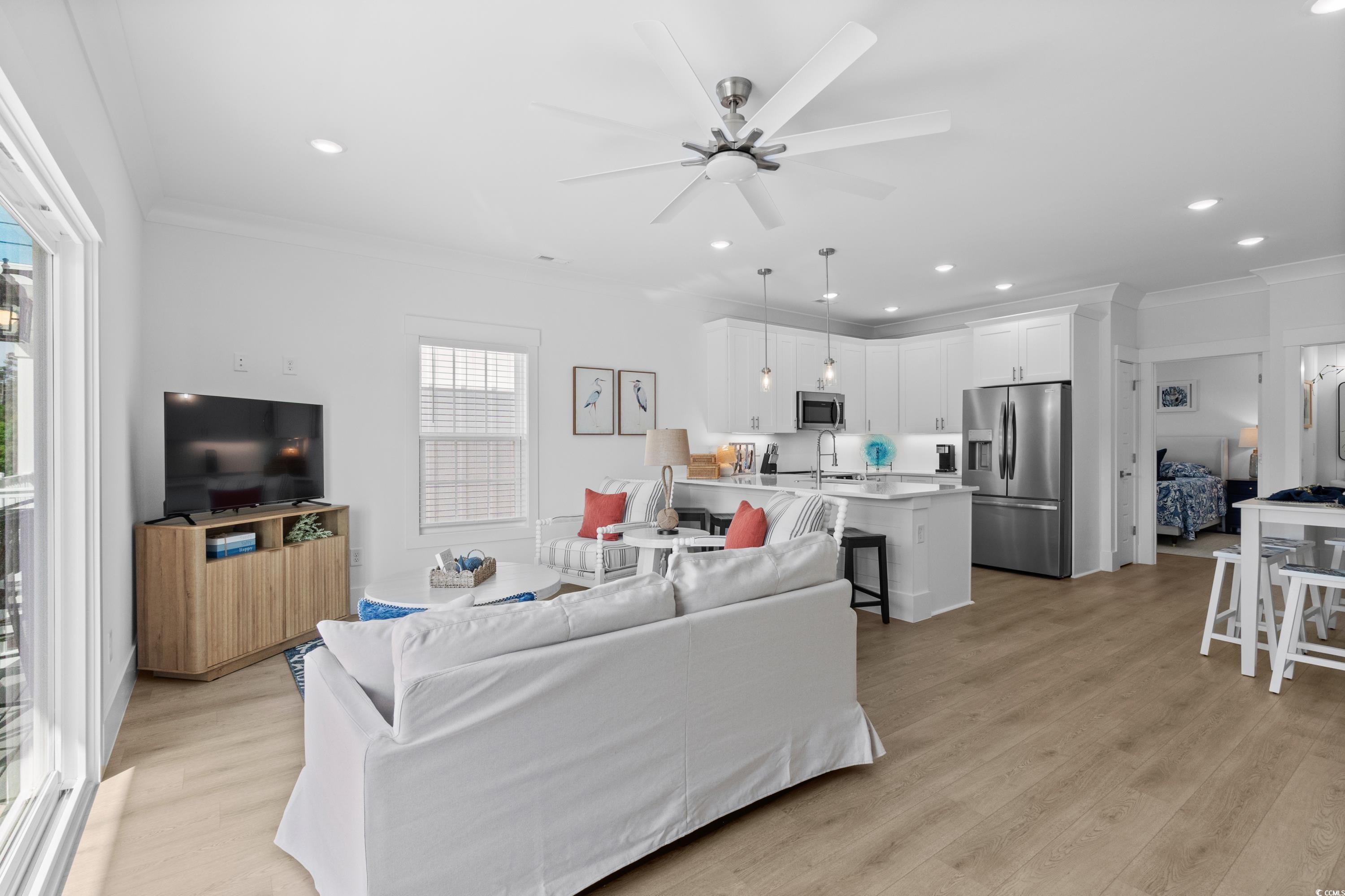 2303 Seaseeker Lane Myrtle Beach, SC 29577 - Photo 15 of 38 Corridor with light wood-style floors, stairway, recessed lighting, and crown molding
