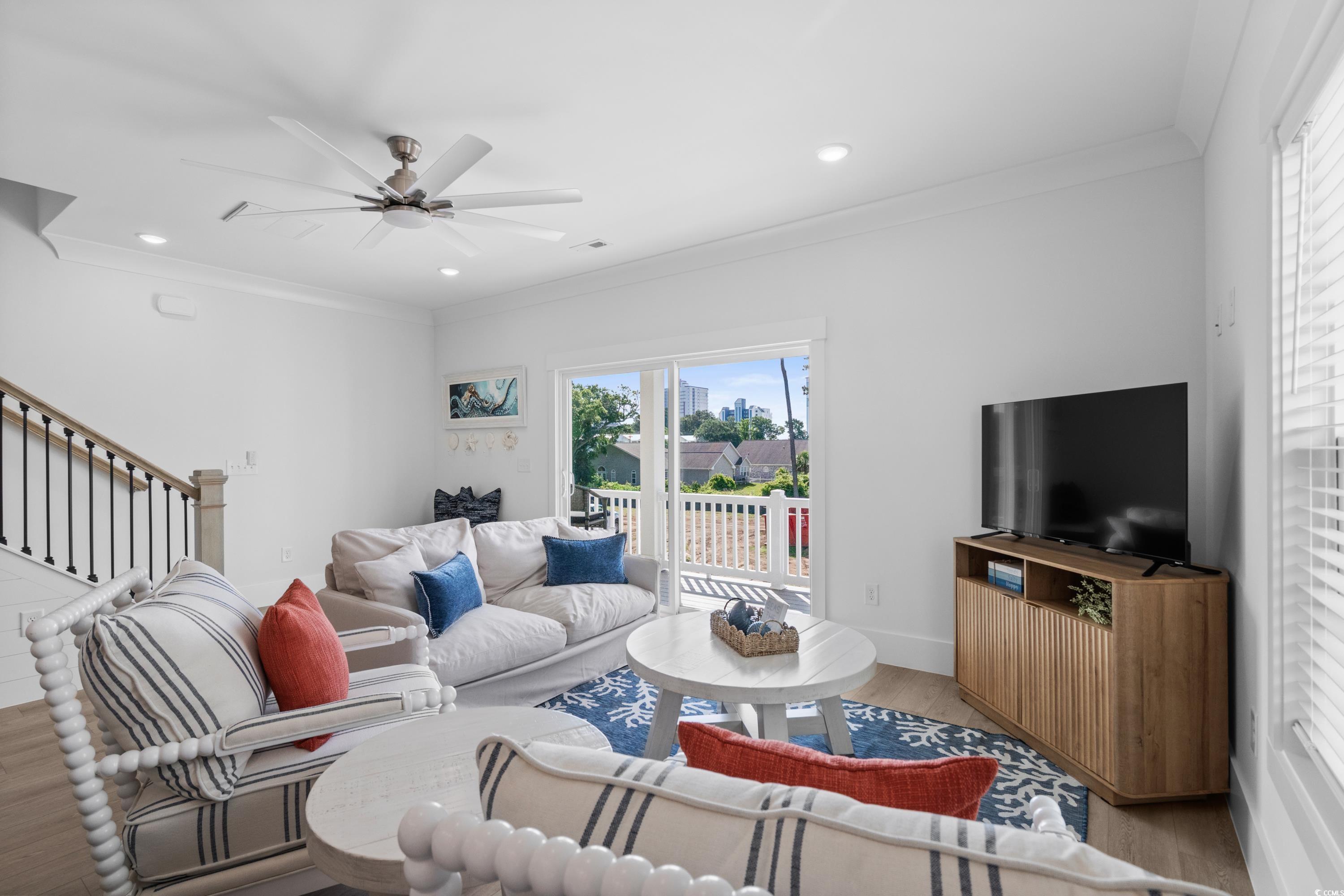 2303 Seaseeker Lane Myrtle Beach, SC 29577 - Photo 16 of 38 Living room featuring ornamental molding, light wood-type flooring, recessed lighting, and ceiling fan