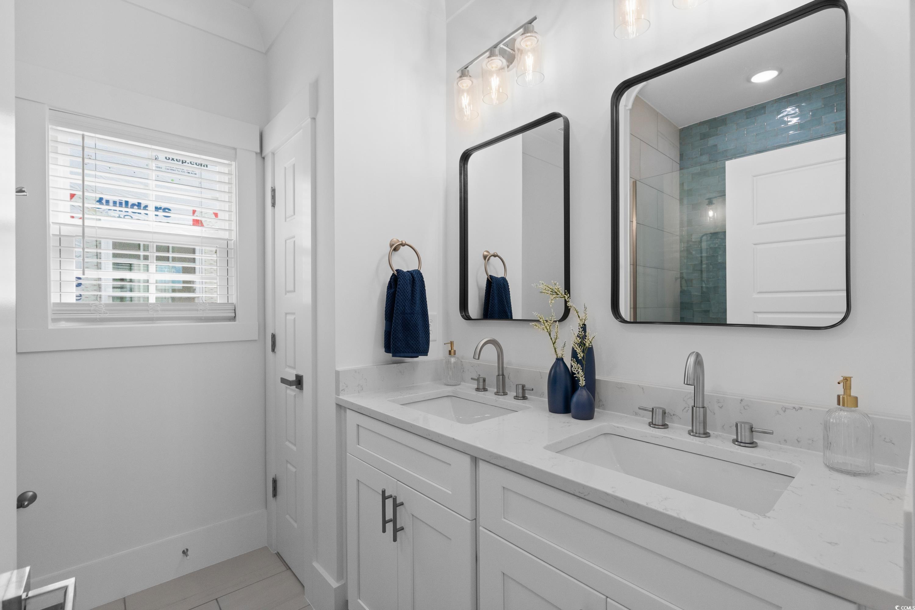 2303 Seaseeker Lane Myrtle Beach, SC 29577 - Photo 23 of 38 Kitchen featuring appliances with stainless steel finishes, a sink, a peninsula, light wood finished floors, and recessed lighting