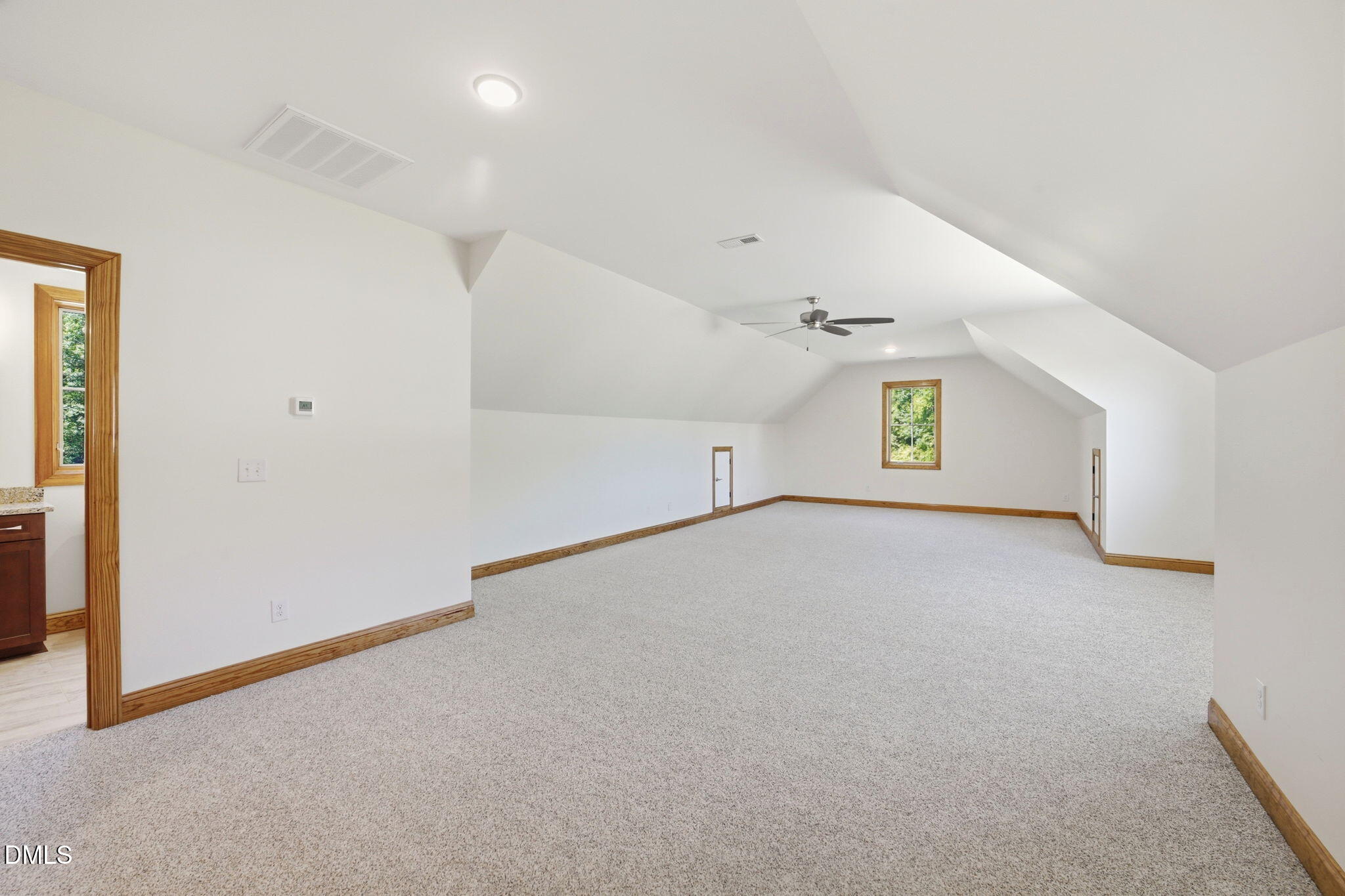 35 North Rippling Court Smithfield, NC 27577 - Photo 41 of 59 an empty room with a window and chandelier