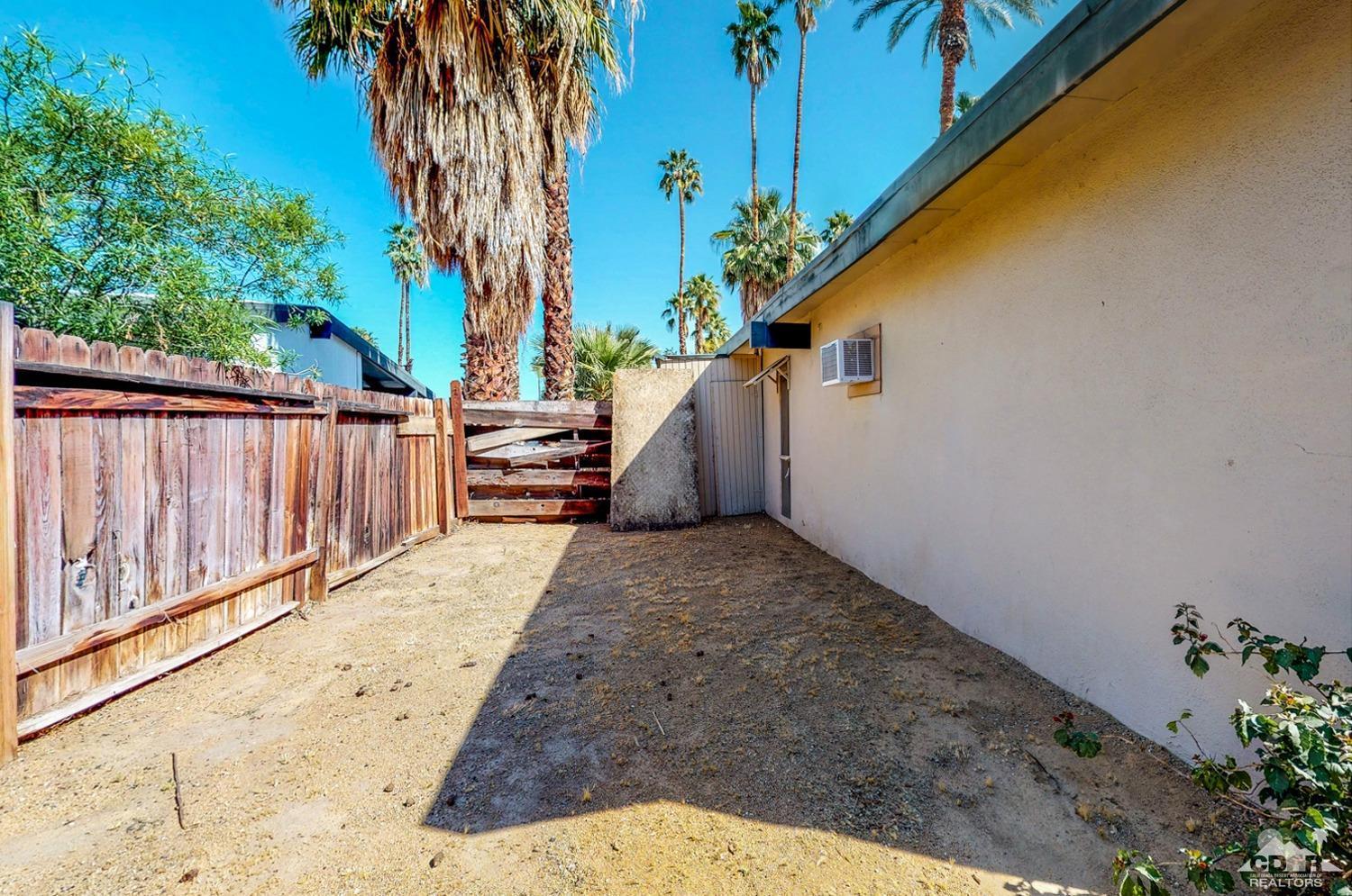 71906 Vista Del Rio Rancho Mirage, CA 92270 - Photo 5 of 27 a view of a backyard with a potted plant