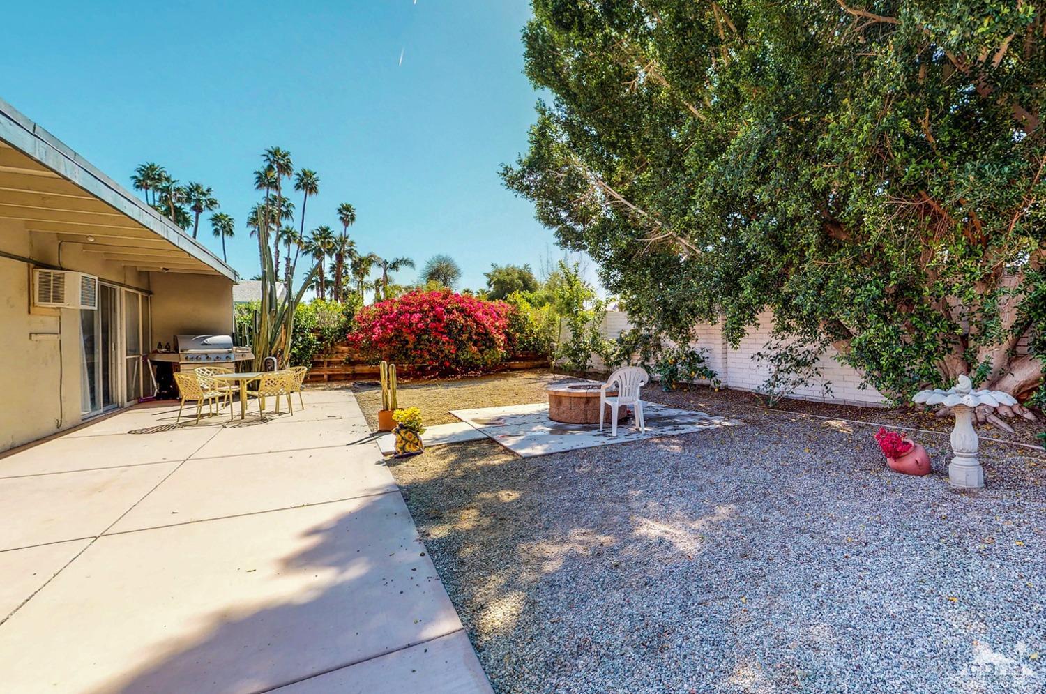 71906 Vista Del Rio Rancho Mirage, CA 92270 - Photo 6 of 27 a view of a backyard with plants and a patio
