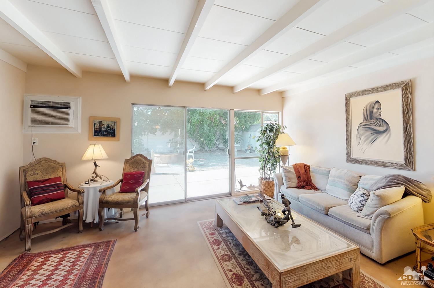 71906 Vista Del Rio Rancho Mirage, CA 92270 - Photo 10 of 27 a living room with furniture and a large window