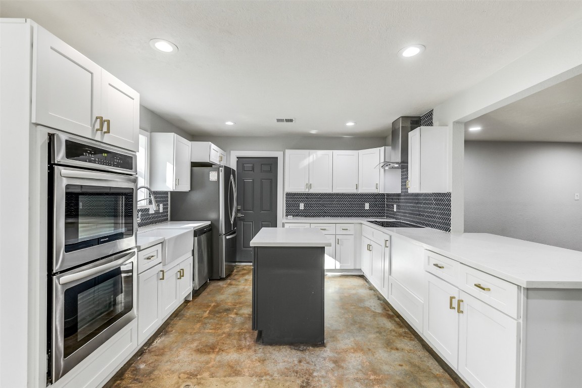 31423 Reids Prairie Road Waller, TX 77484 - Photo 11 of 49 a kitchen with a sink stove and oven