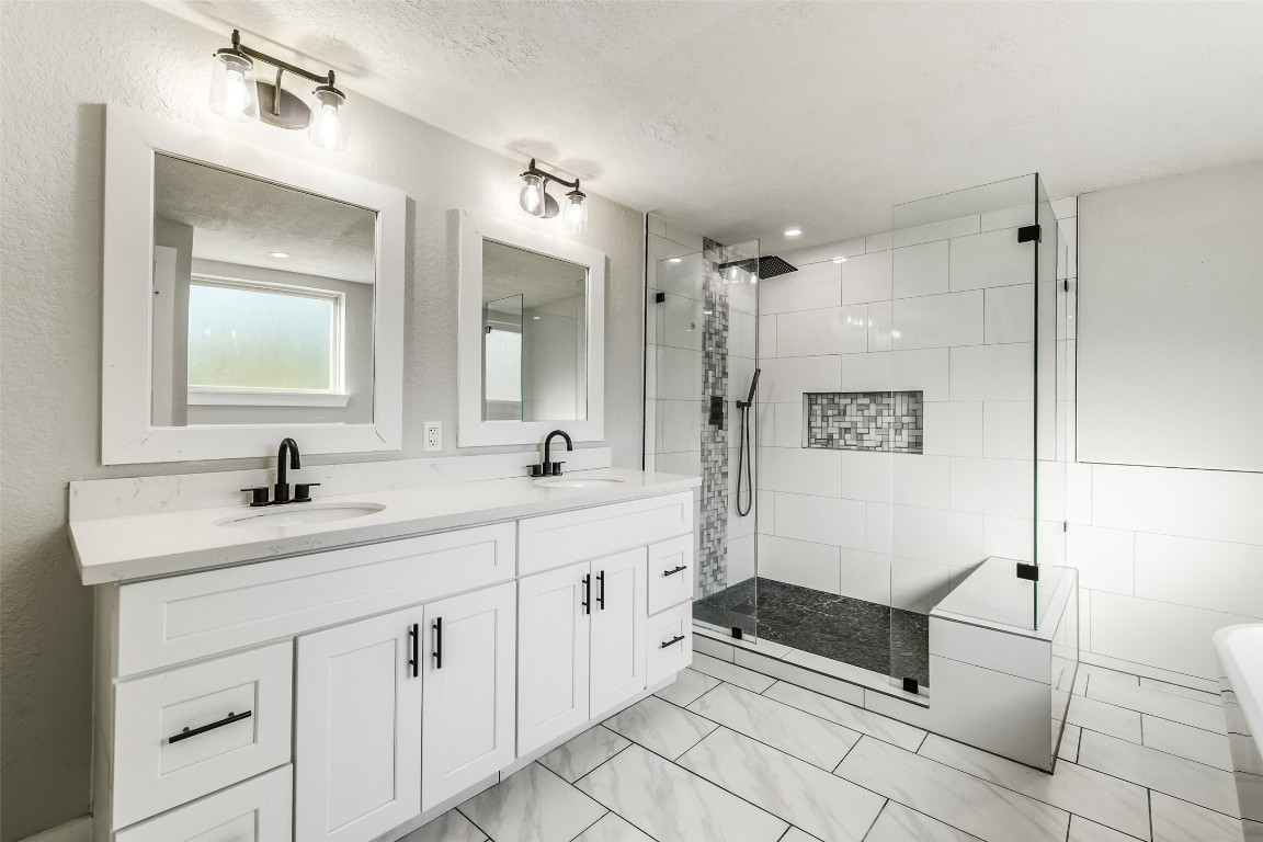 31423 Reids Prairie Road Waller, TX 77484 - Photo 21 of 49 a spacious bathroom with a double vanity sink mirror and a bathtub