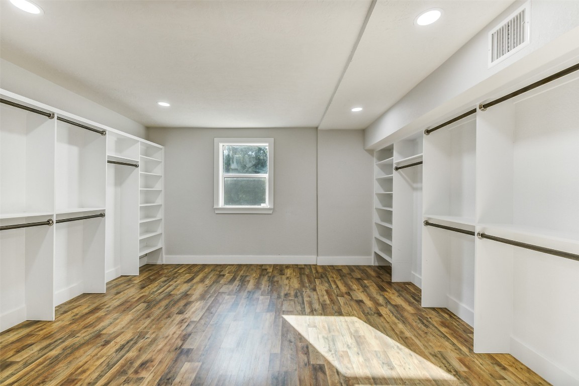 31423 Reids Prairie Road Waller, TX 77484 - Photo 23 of 49 a view of empty room with wooden floor and fan