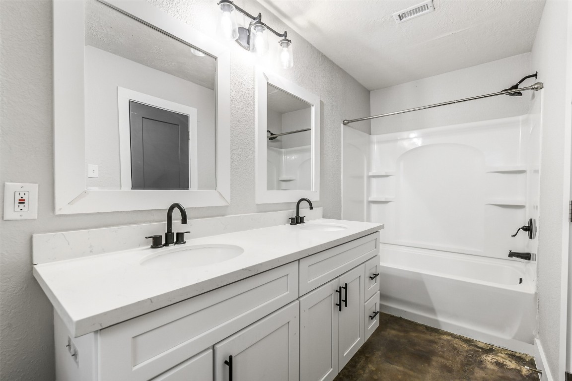 31423 Reids Prairie Road Waller, TX 77484 - Photo 26 of 49 a bathroom with a sink double vanity granite tub shower and a mirror