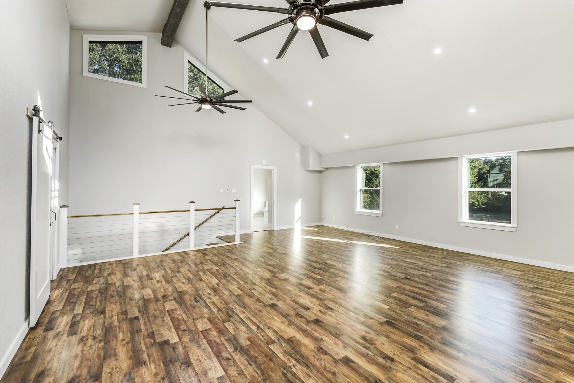 31423 Reids Prairie Road Waller, TX 77484 - Photo 31 of 49 a view of empty room with wooden floor and fan