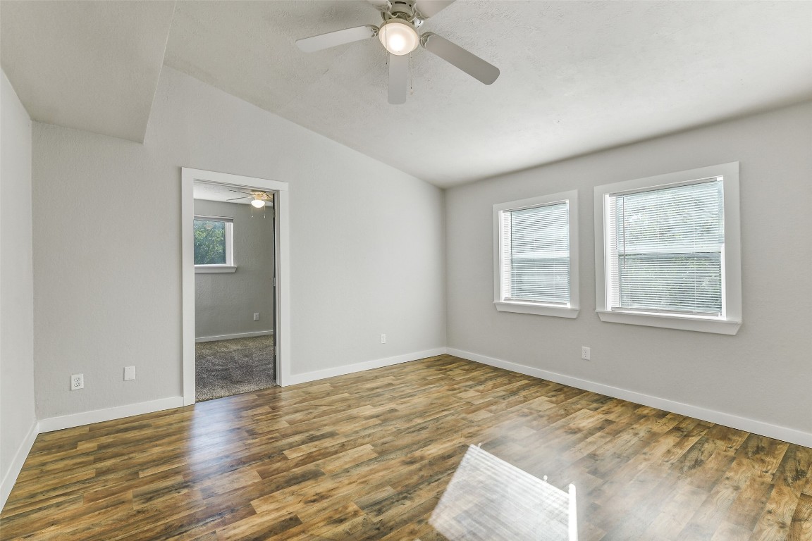 31423 Reids Prairie Road Waller, TX 77484 - Photo 32 of 49 a view of an empty room with window and wooden floor
