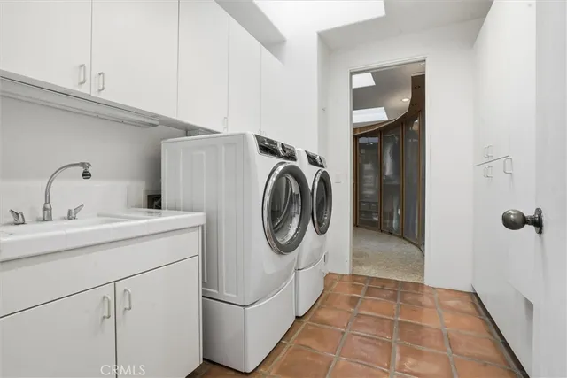 a bathroom with a double vanity sink and mirror