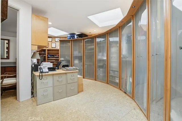 a view of a hallway with paintings on the wall
