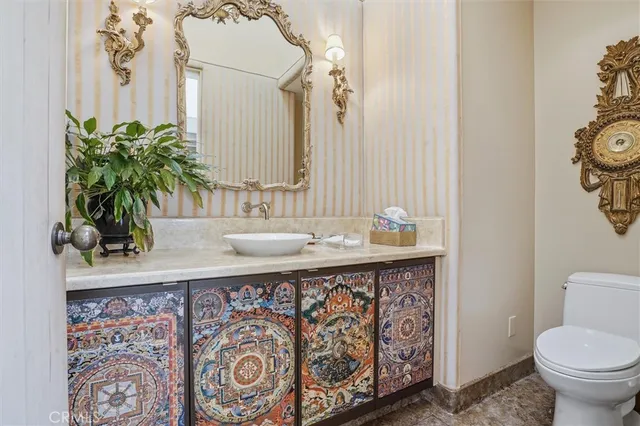 a hallway with closet and mirror