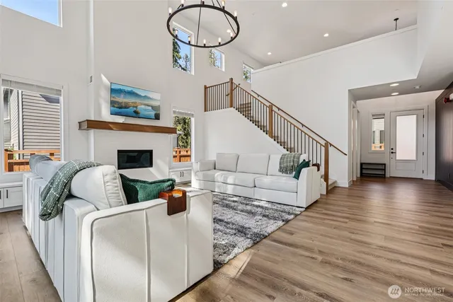 a dining room with furniture and wooden floor