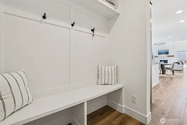a living room with furniture and a pool table