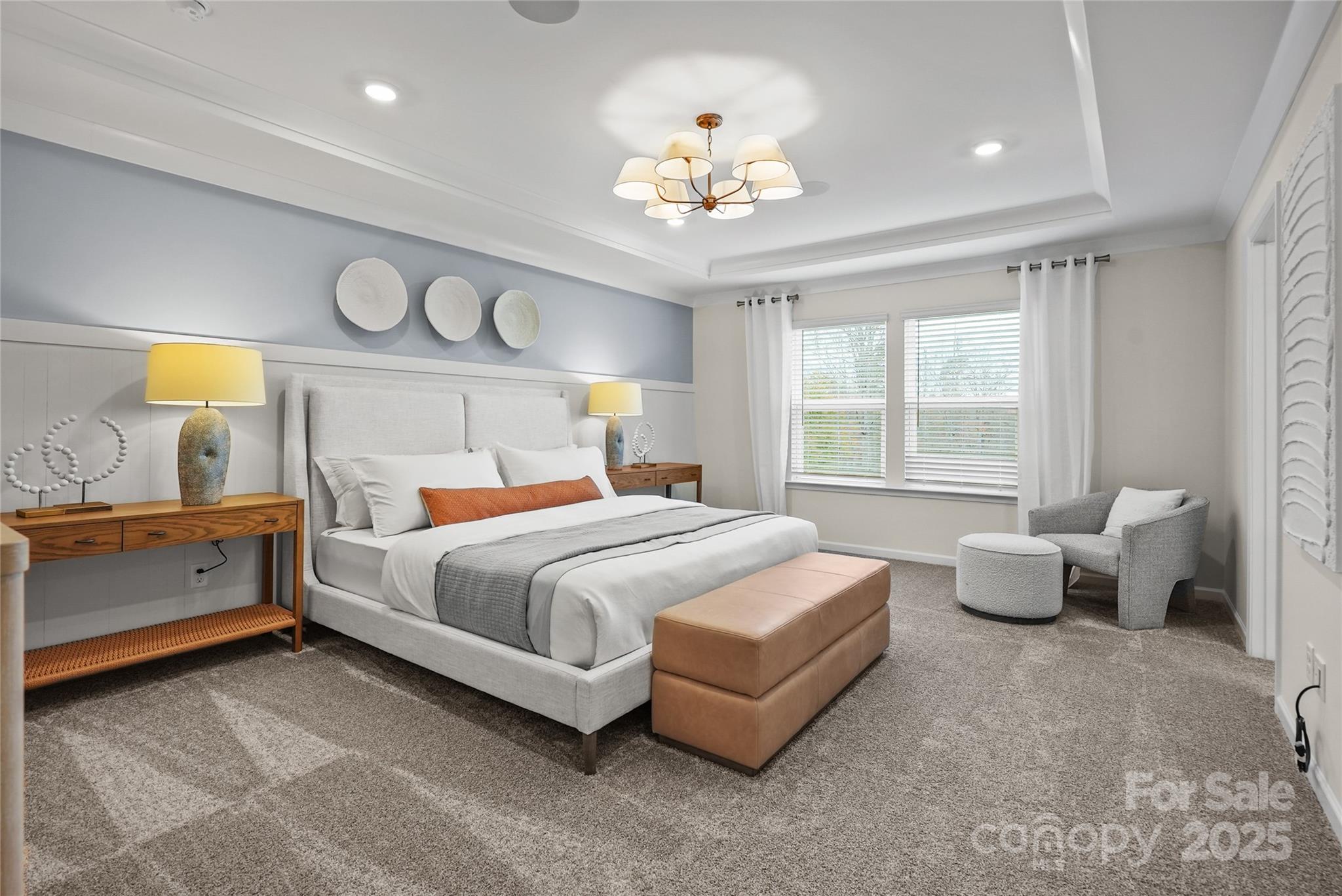 13736 Roderick Drive, Unit 171 Huntersville, NC 28078 - Photo 11 of 14 a spacious bedroom with a bed and a chandelier