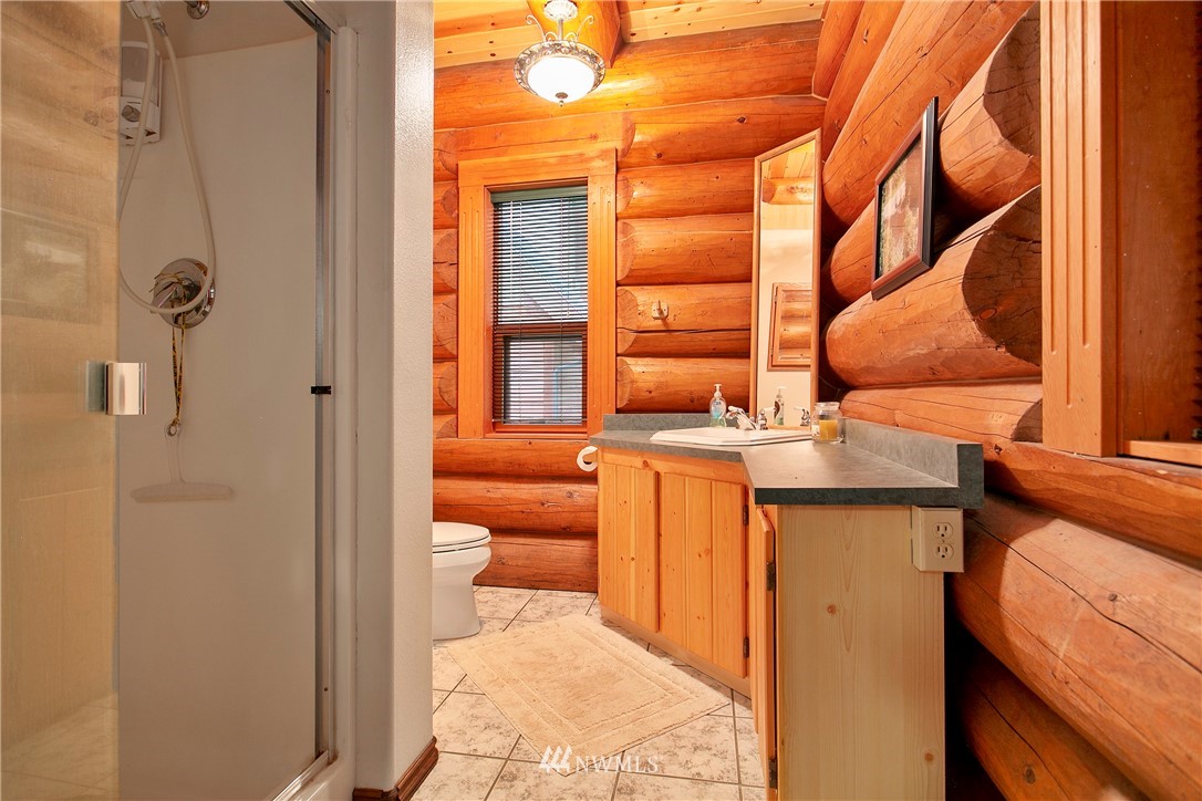 7097 Rainier Way Deming, WA 98244 - Photo 11 of 37 a view of bathroom with a sink and mirror