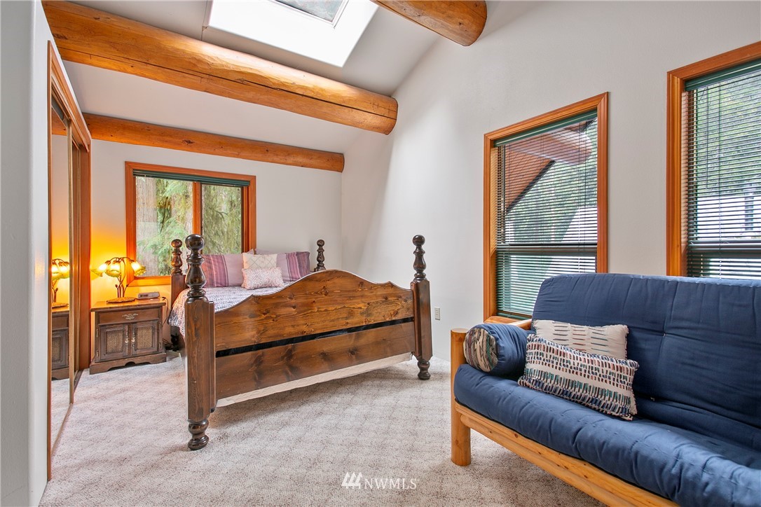 7097 Rainier Way Deming, WA 98244 - Photo 13 of 37 a bedroom with furniture and a large window