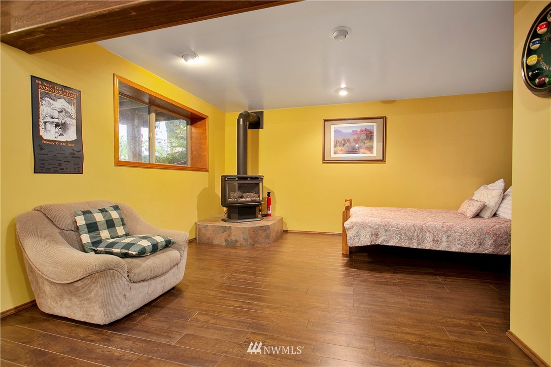 7097 Rainier Way Deming, WA 98244 - Photo 19 of 37 a living room with furniture and a wooden floor