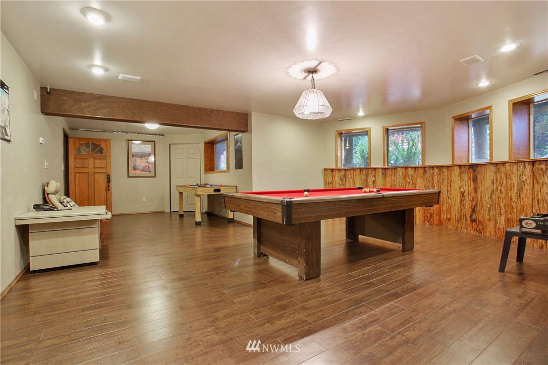 7097 Rainier Way Deming, WA 98244 - Photo 20 of 37 a room with furniture pool table wooden floor and windows