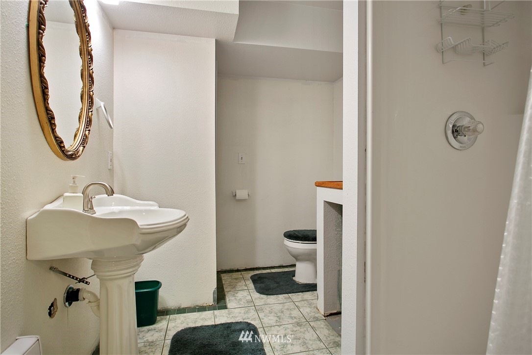 7097 Rainier Way Deming, WA 98244 - Photo 22 of 37 a bathroom with a sink and mirror