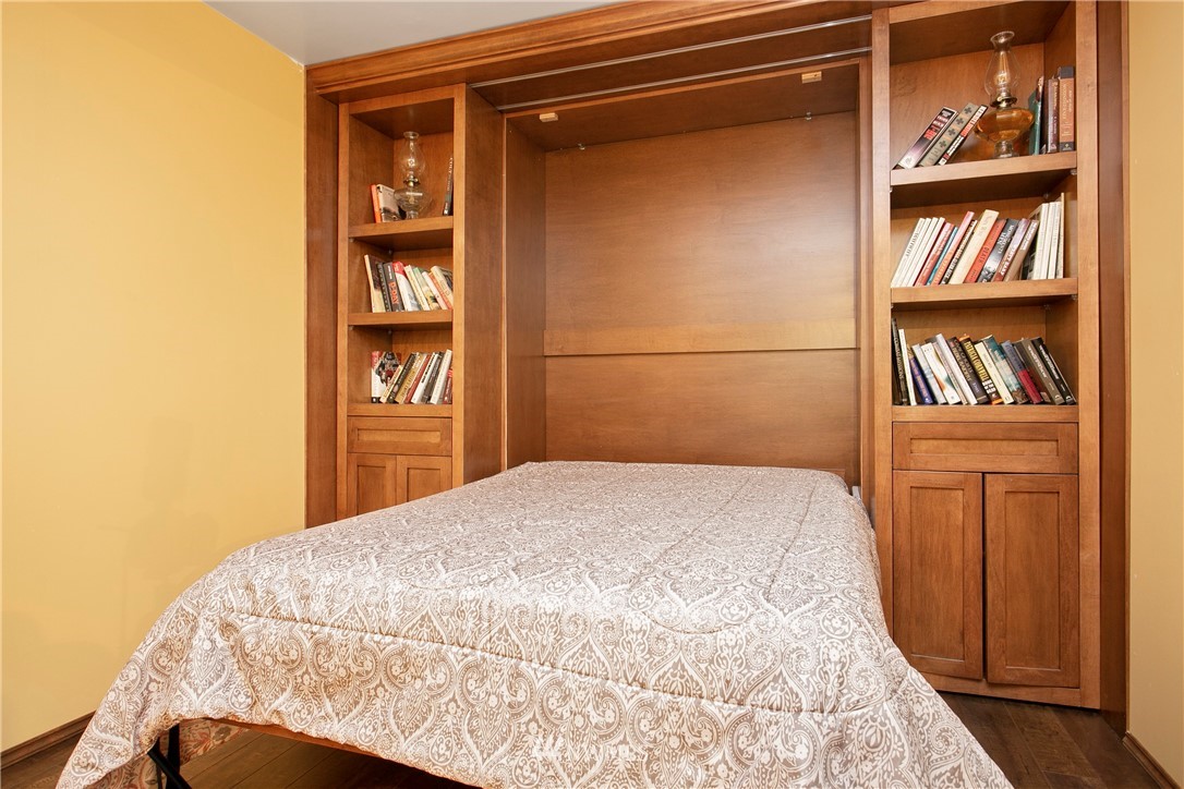 7097 Rainier Way Deming, WA 98244 - Photo 23 of 37 a bedroom with a bed and a book shelf