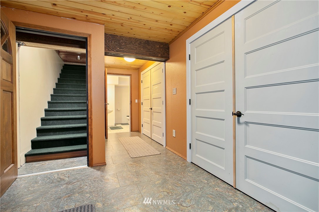 7097 Rainier Way Deming, WA 98244 - Photo 25 of 37 a view of a hallway with wooden floor and entryway