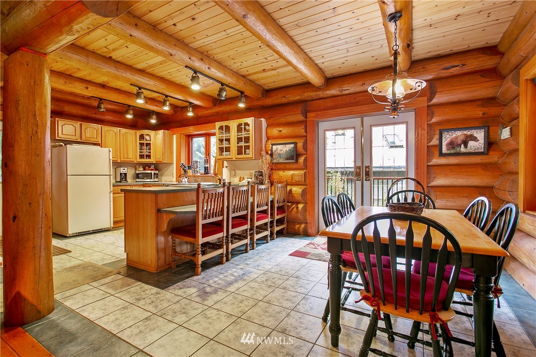 7097 Rainier Way Deming, WA 98244 - Photo 7 of 37 a view of a dining room with furniture window and outside view