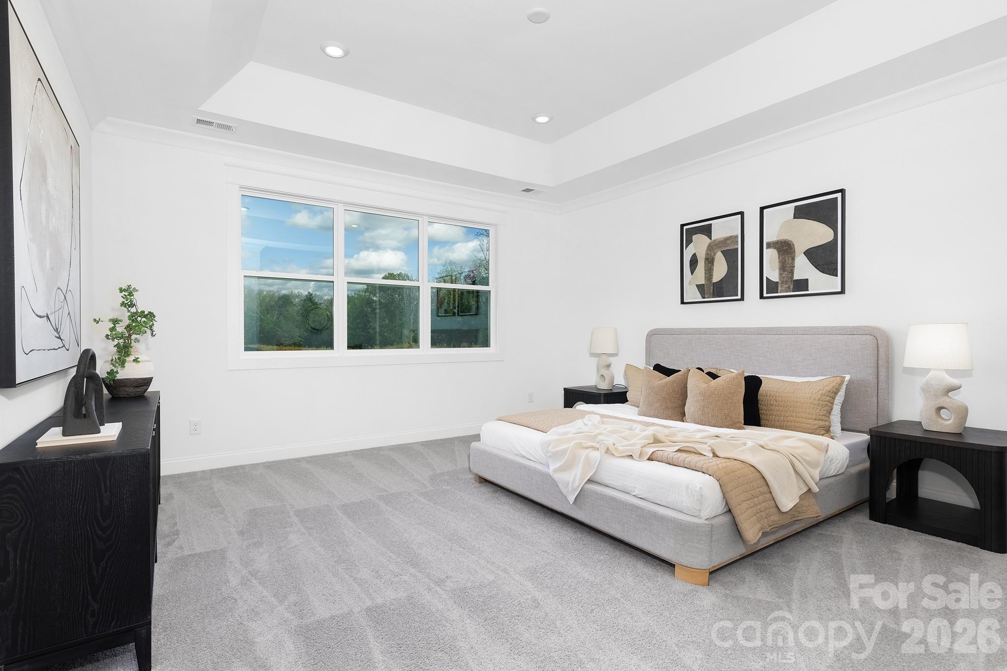 220 Windy Dell Drive Tega Cay, SC 29708 - Photo 12 of 13 a bedroom with a bed and wooden floor