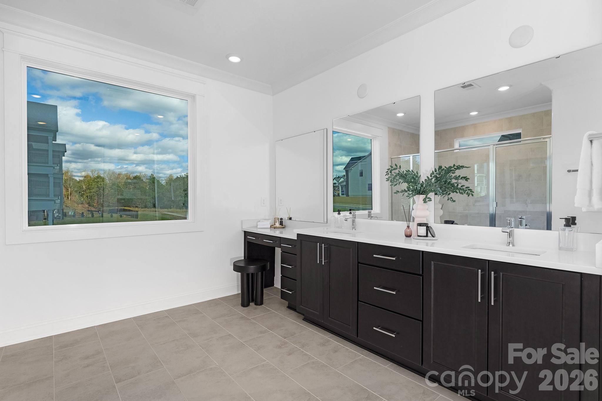 220 Windy Dell Drive Tega Cay, SC 29708 - Photo 13 of 13 a spacious bathroom with a double vanity sink mirror and window
