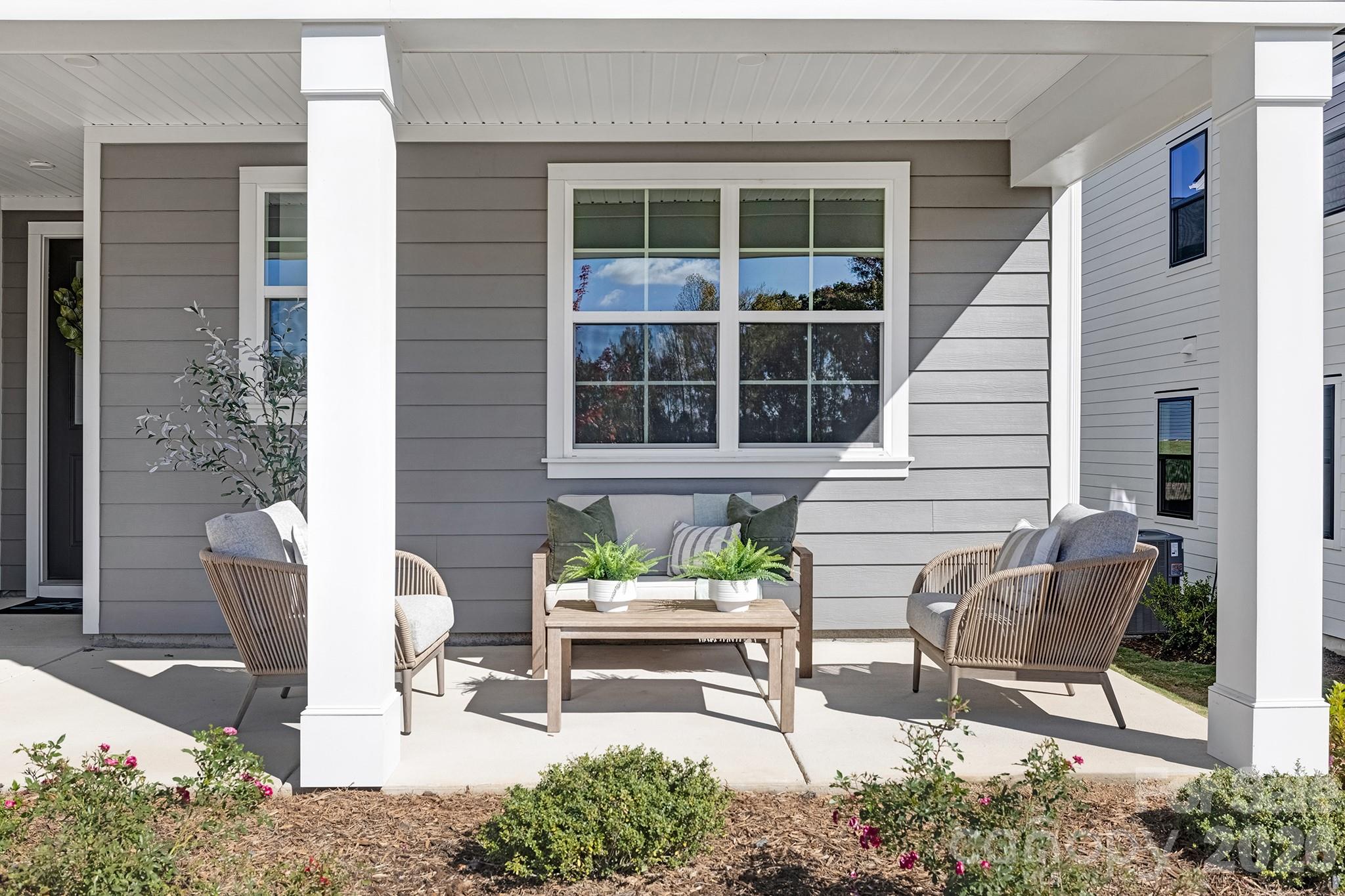 220 Windy Dell Drive Tega Cay, SC 29708 - Photo 2 of 13 a view of two chairs in a patio