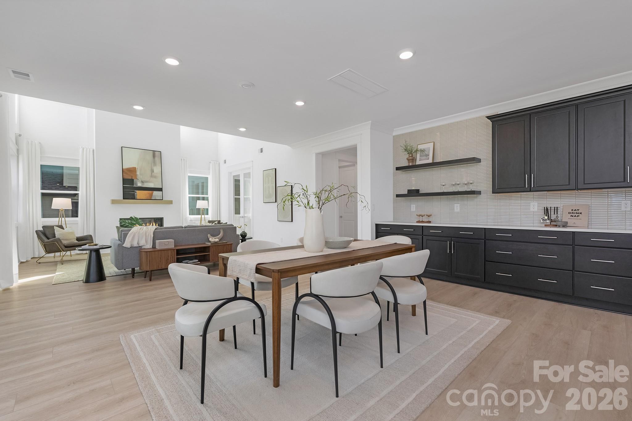 220 Windy Dell Drive Tega Cay, SC 29708 - Photo 5 of 13 a kitchen with a table chairs sink and cabinets