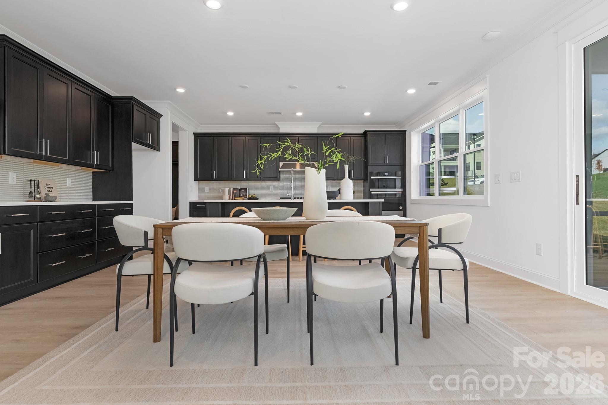 220 Windy Dell Drive Tega Cay, SC 29708 - Photo 6 of 13 a view of a dining room with furniture