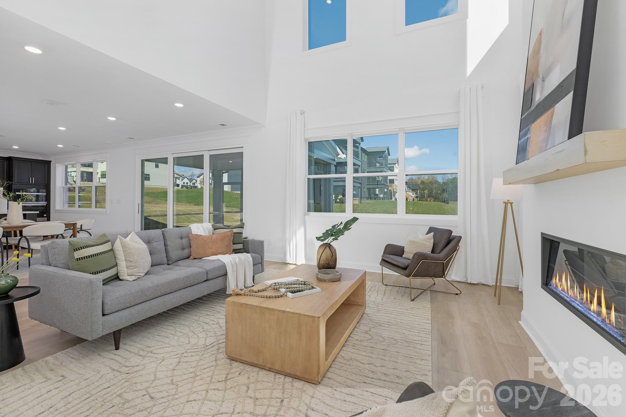 220 Windy Dell Drive Tega Cay, SC 29708 - Photo 7 of 13 a living room with furniture and a fireplace