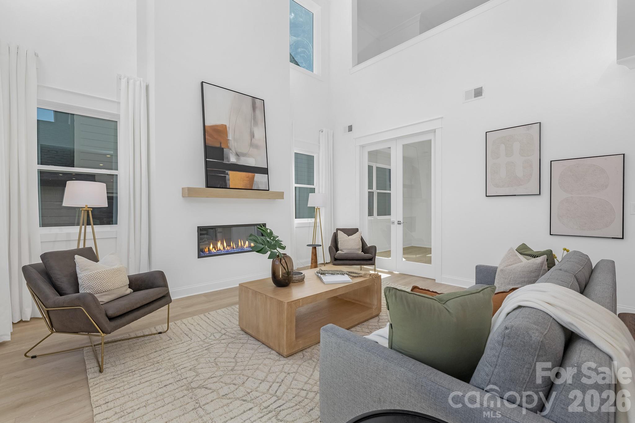 220 Windy Dell Drive Tega Cay, SC 29708 - Photo 8 of 13 a living room with furniture and a fireplace