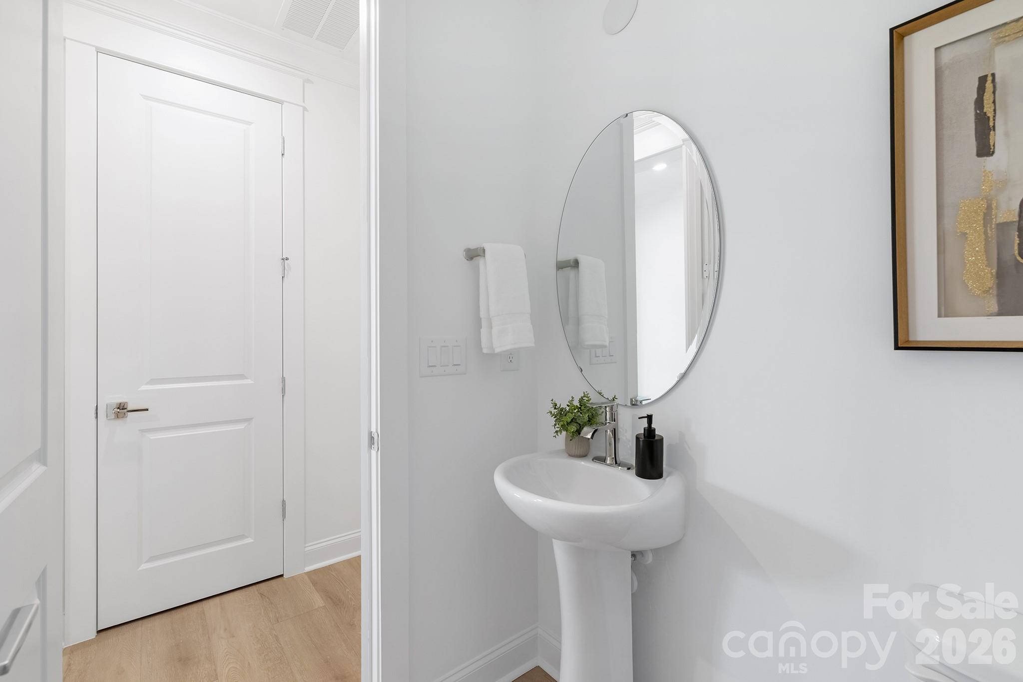 220 Windy Dell Drive Tega Cay, SC 29708 - Photo 10 of 13 a bathroom with a sink and a mirror