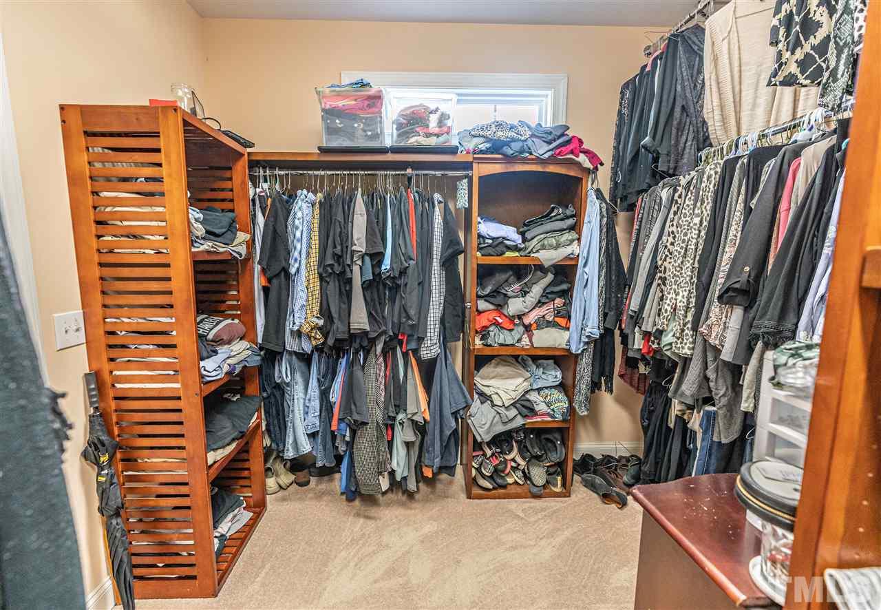 535 Barber Road Carthage, NC 28327 - Photo 17 of 30 a view of walk in closet with clothes