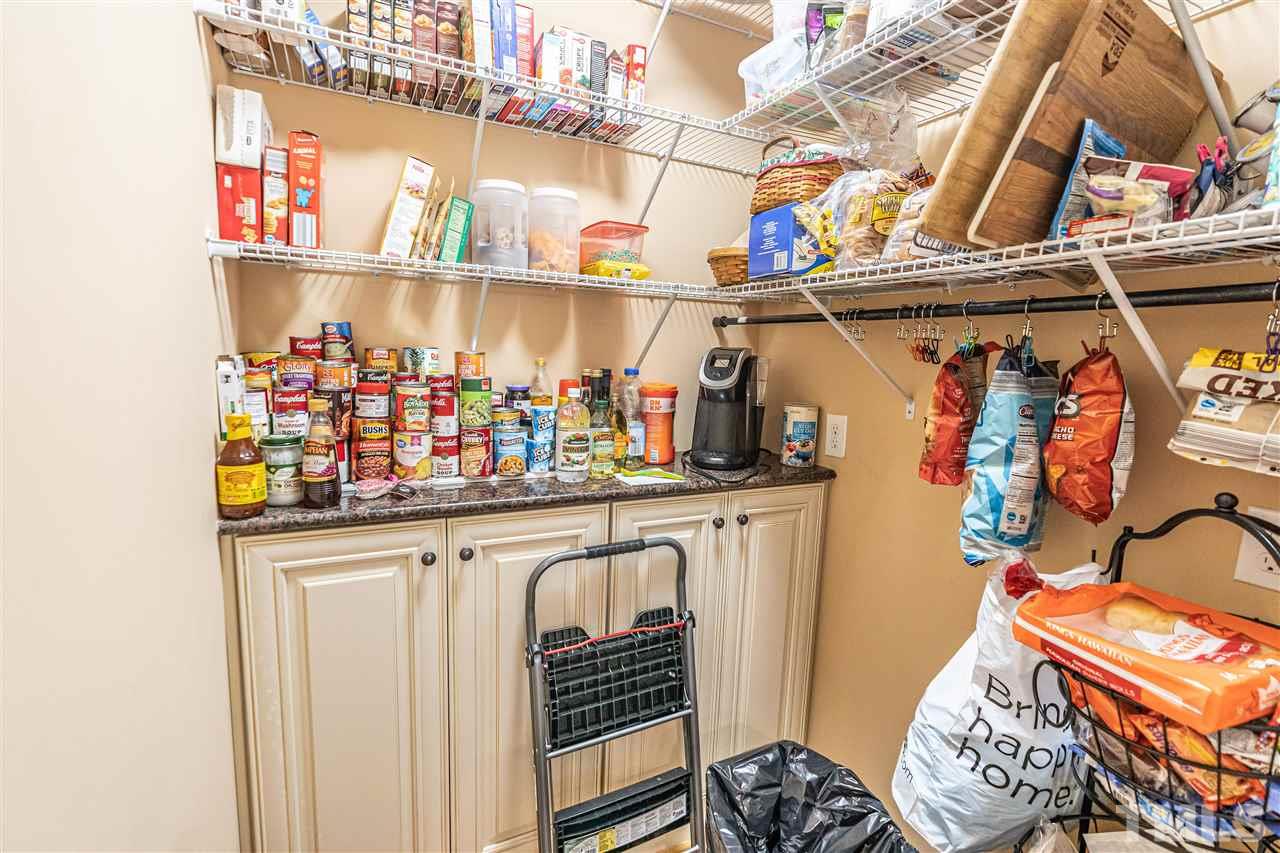535 Barber Road Carthage, NC 28327 - Photo 27 of 30 a kitchen with lots of bottles of alcohol