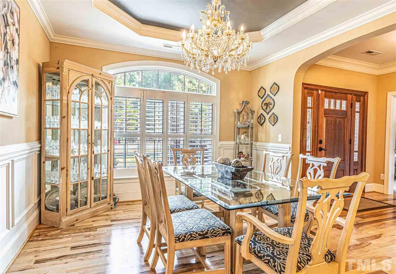 535 Barber Road Carthage, NC 28327 - Photo 8 of 30 a view of a dining room with furniture a chandelier and large windows