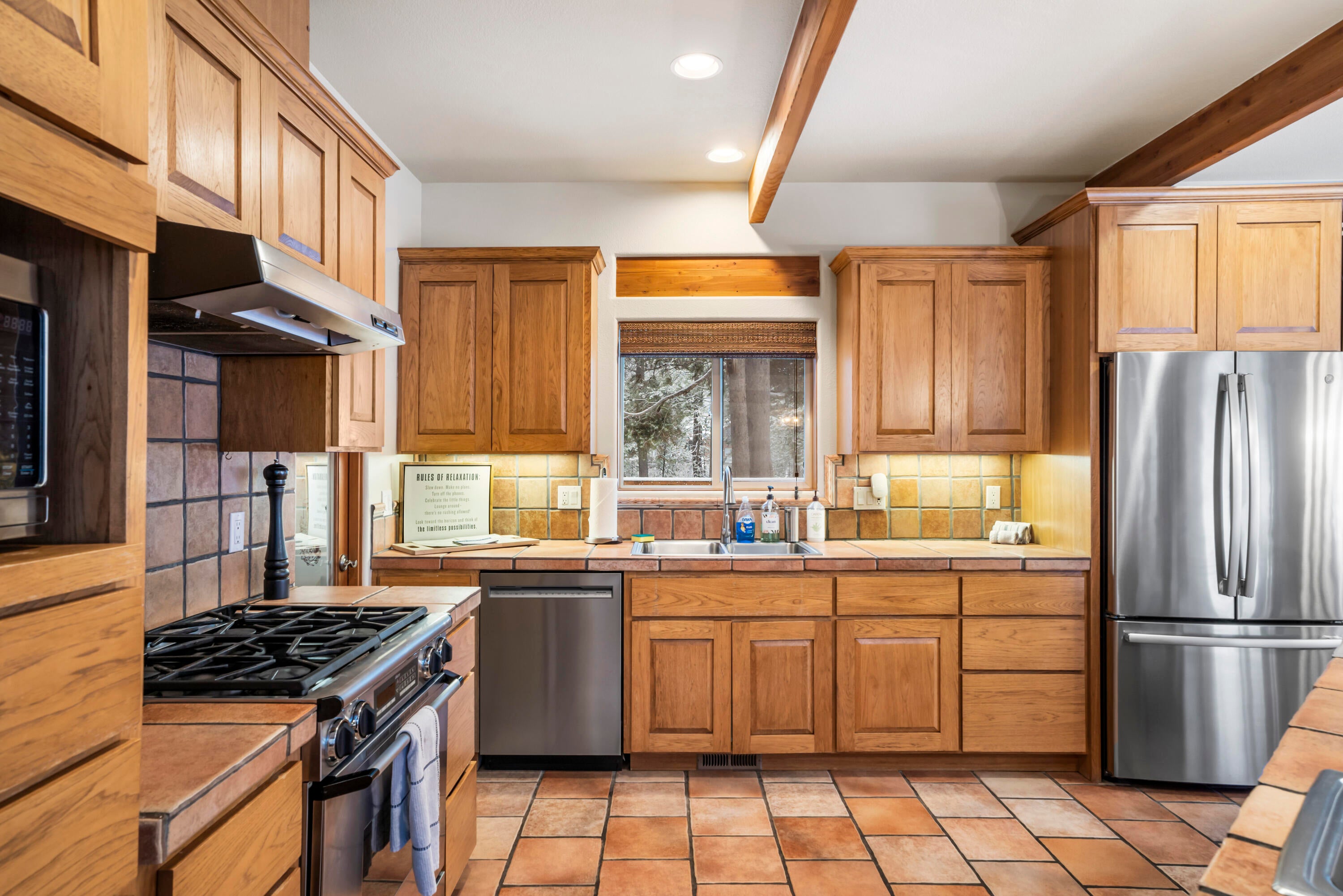 56065 Snow Goose Road Bend, OR 97707 - Photo 13 of 65 Plenty of room for everyone to gather around the kitchen/dining area to prepare and enjoy meals together!