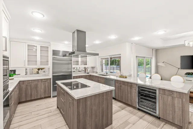 a kitchen with a sink stove and cabinets