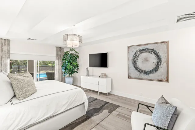 a bedroom with bed and windows