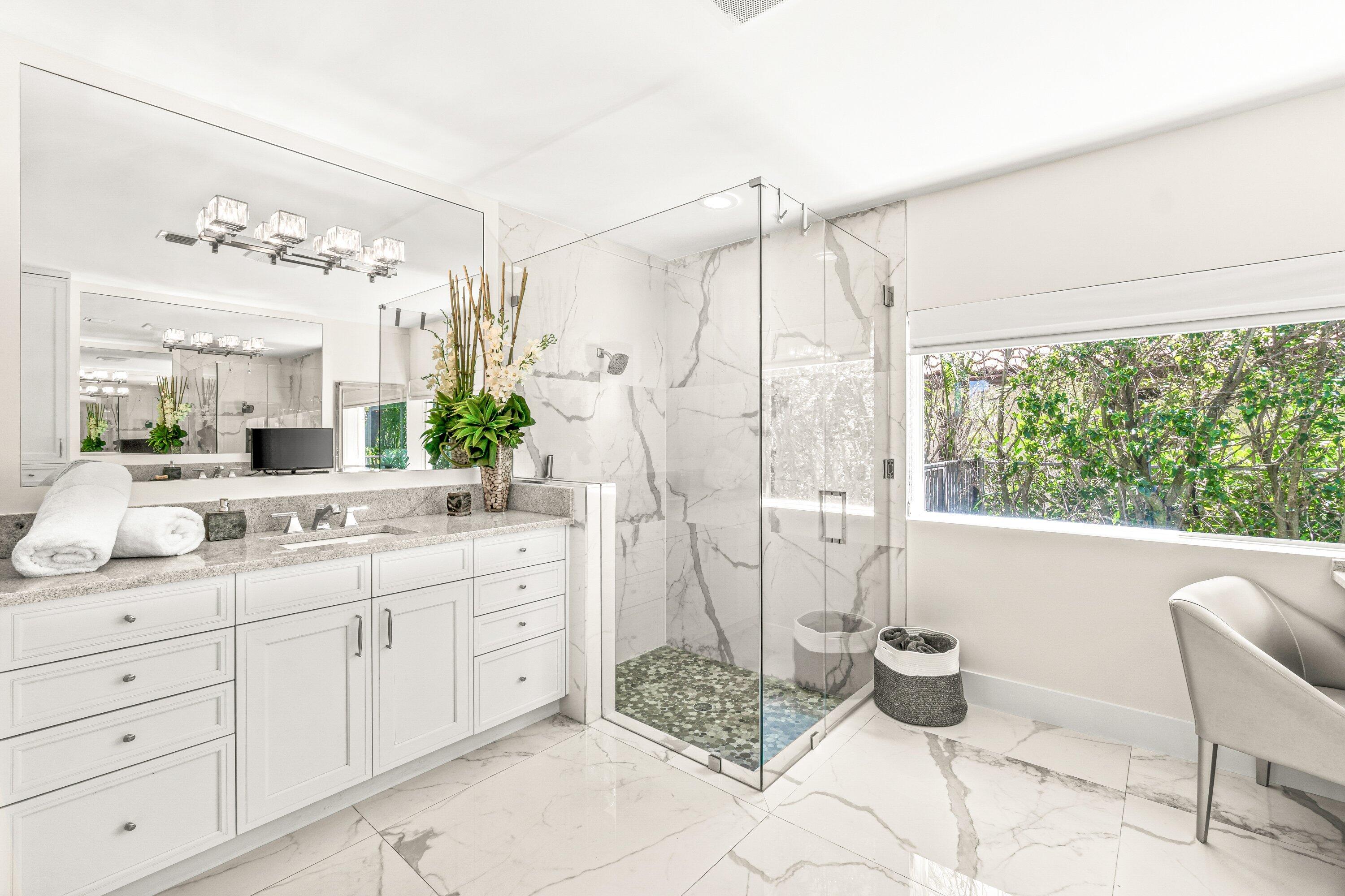 2367 Queen Palm Road Boca Raton, FL 33432 - Photo 25 of 45 a spacious bathroom with a granite countertop sink and a mirror