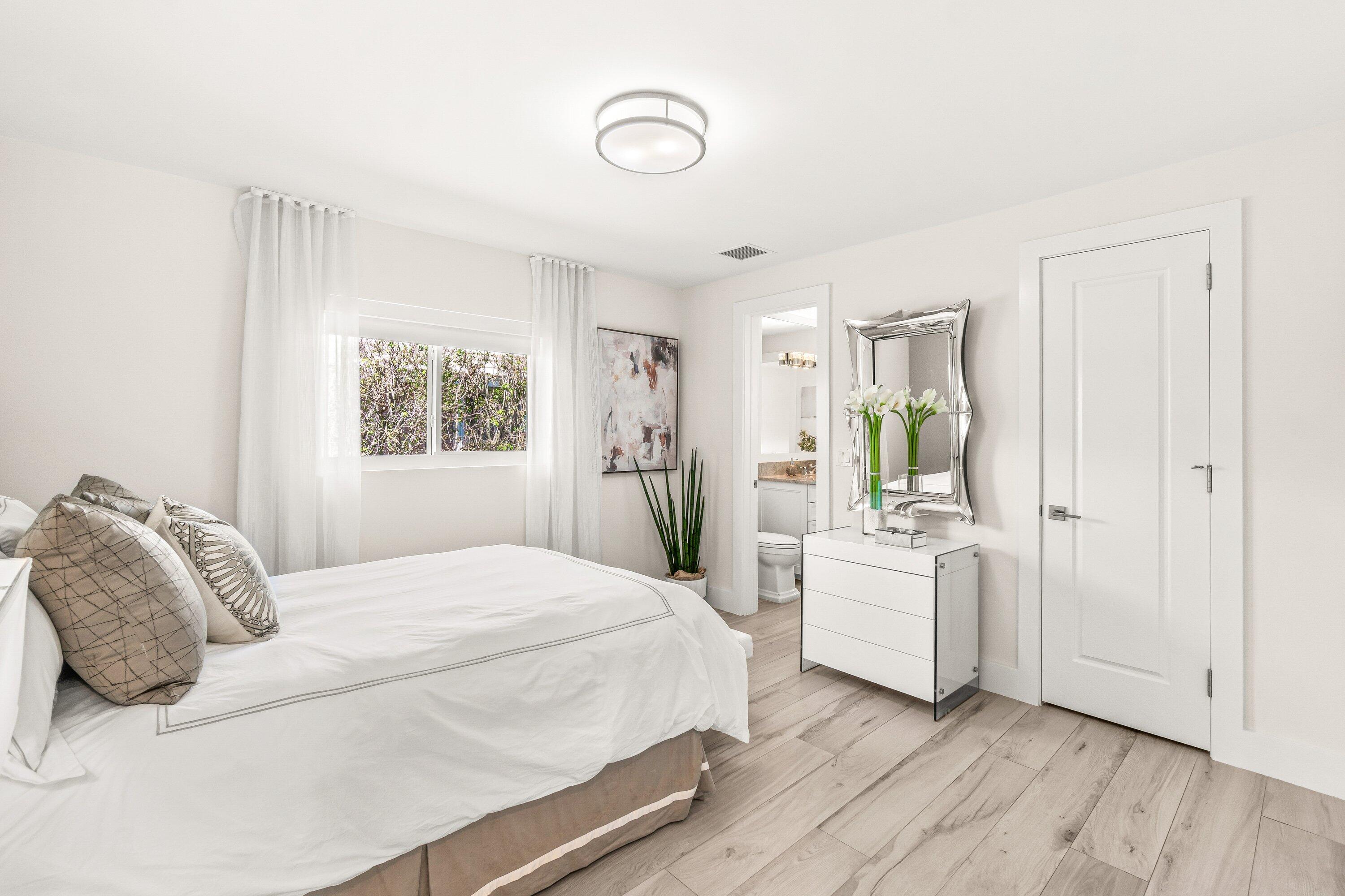 2367 Queen Palm Road Boca Raton, FL 33432 - Photo 30 of 45 a bedroom with a large bed and a window