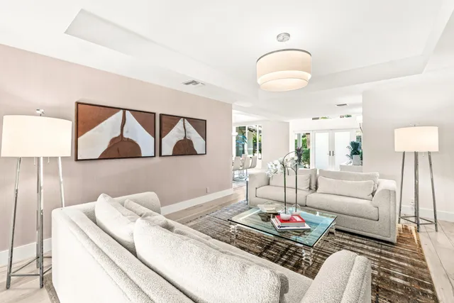 a living room with furniture and a lamp